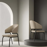 Beige leather wrap-back dining chair with durable frame and light cushioned seat